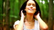 Pretty young fashion model posing in the woods