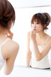a portrait of beautiful asian woman brushing teeth