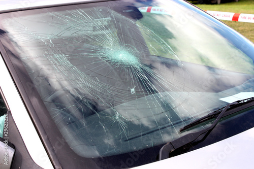 Photo: A Broken Car Windscreen at an Accident Site. A Broken Car Windscreen at an Accident Site.
