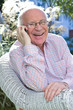 Happy old man on a phone