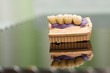 Dental bridge made of porcelain on casting