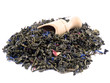 Aromatic green tea and wooden shovel on white