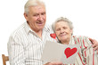 happy old couple with post-card happy old couple with post-card