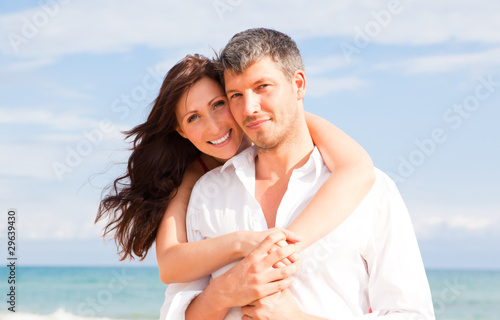 Photo: embracing summer couple embracing summer couple