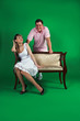 A girl and guy isolated on green A girl and guy isolated on green