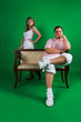 A man and girl isolated on green A man and girl isolated on green