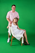A man and girl isolated on green A man and girl isolated on green