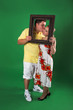 A man and girl isolated on green A man and girl isolated on green
