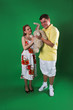 A man and girl isolated on green A man and girl isolated on green