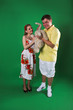 A man and girl isolated on green A man and girl isolated on green