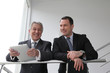 Sales people working on electronic tablet
