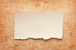ripped piece of paper on grunge paper background. vintage retro ripped piece of paper on grunge paper background. vintage retro