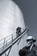 oil-workers and fuel-storage tank