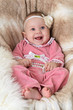 Smiling baby on a beautiful beige background