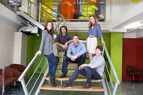 Photo: Group of people on stairs in office Group of people on stairs in office