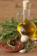Olive oil, garlic, peppercorns and rosemary.