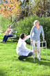 Helping elder woman to walk