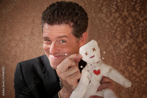Photo: Man with a Voodoo doll Man with a Voodoo doll