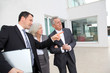 Photo : Senior couple visiting luxury villa with real-estate agent