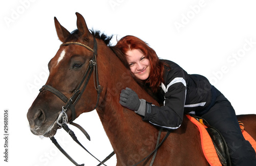 Photo: Smiling girl on a horseback Smiling girl on a horseback
