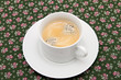 the cup of coffee on the table