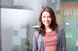 Smiling young woman in office