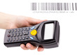 Electronic manual scanner of bar codes in woman hand