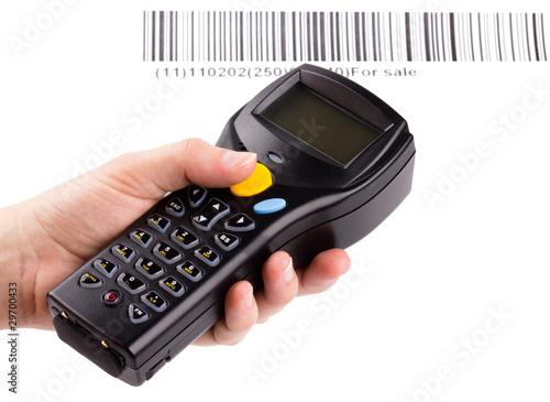 Photo: Electronic manual scanner of bar codes in woman hand Electronic manual scanner of bar codes in woman hand