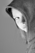 girl hiding behind hood