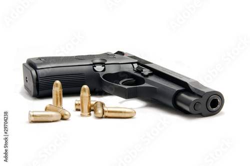 Photo: firearm with ammunition in white background firearm with ammunition in white background