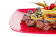 food: roast beef meat over red plate