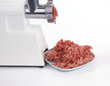 Meat grinder in action. Raw beef