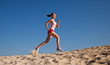 girl runs on sand