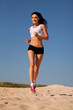 girl runs on sand