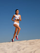 girl runs on sand