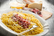 carbonara on dish with ingredients carbonara on dish with ingredients