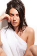 Portrait of attractive girl covering your body by white silk