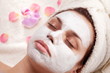 Woman face with cosmetic mask on it.