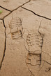 Photo: Boot Footprints in Dry Cracked Earth Boot Footprints in Dry Cracked Earth