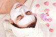 Woman face with cosmetic mask on it.