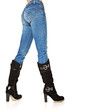 Photo: female legs in a blue jeans and high boots female legs in a blue jeans and high boots