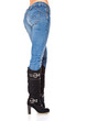 Photo: female legs in a blue jeans and high boots female legs in a blue jeans and high boots