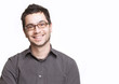 Young man with glasses smiling