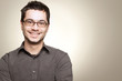 Photo: Young man with glasses smiling Young man with glasses smiling