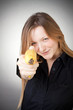 Image of girl holds banana as a gun Image of girl holds banana as a gun