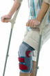Bandage on knee of man's on crutches Bandage on knee of man's on crutches