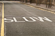 Slow sign on the road Slow sign on the road