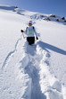 Woman on a snow path in the mountains