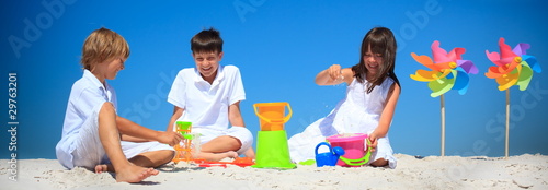 Photo: Children playing in beach sand Children playing in beach sand