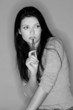 thoughtful woman with pen